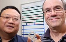 Dr. Gang Wang, left, and Dr. David (Andy) Hissam with a prototype piezoelectric washer