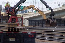 Delta Railroad Construction off-loading 115lb rail for new North Shore Connector transit line in Pittsburgh (courtesy L.B. Foster).