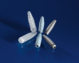 The new composite screw (center) with titanium screw (right) and older polylactic acid screw (left) � courtesy the Fraunhofer Institute