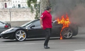 A screen grab from a YouTube video reportedly recorded in Paris depicts a Ferrari 458 with its left rear f ender burning.