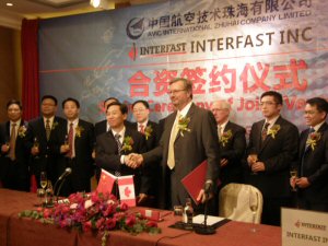 Wang Zhilai, GM of AVIC International Zhuhai Co. Ltd., and Peter Oleck, president of Interfast, pictured during a signing ceremony in Hong Kong